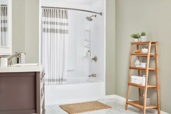 A bathroom with a wooden ladder shelf