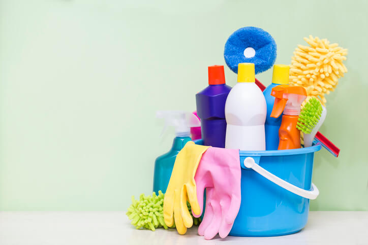 How to clean a bathroom: Bucket with chemical products in the bathroom