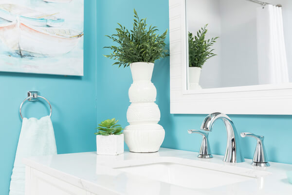 A clean bathroom countertop and sink