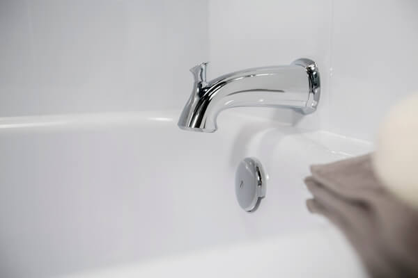 close-up shot of a shiny bathtub faucet