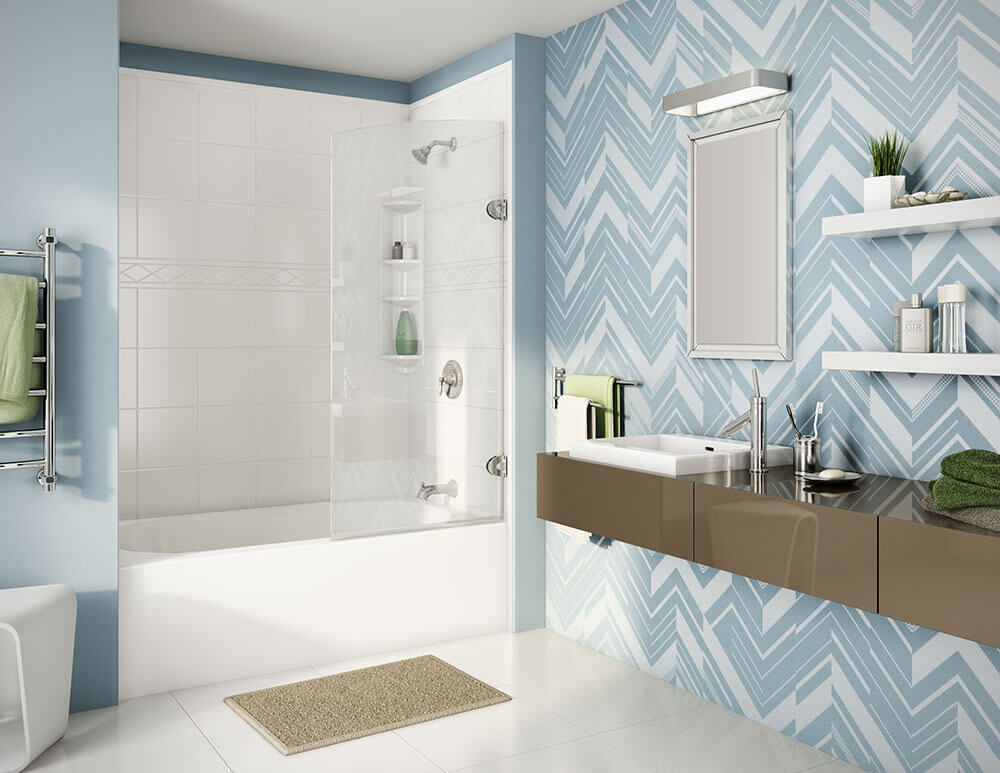 beautiful blue bathroom with a white bathtub and a geometric patterned blue wallpaper