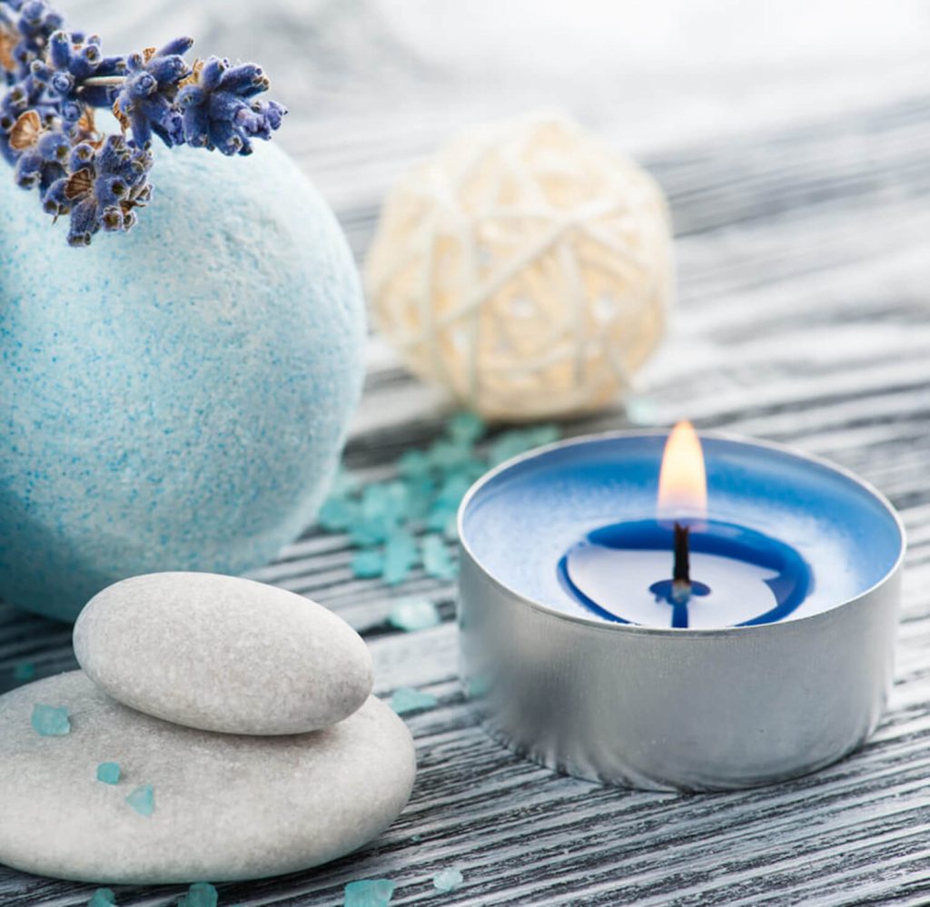 Blue tea light with bath bombs and stones