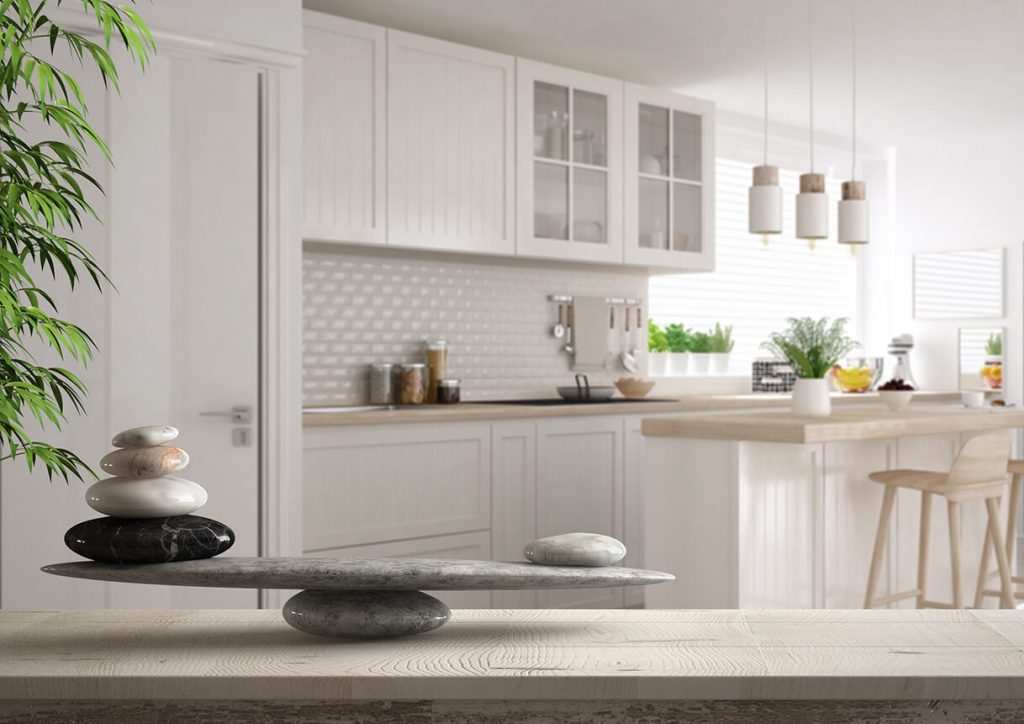 White kitchen with stone formation on counter