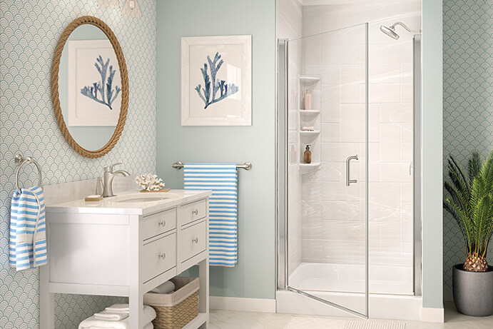 Nautical inspired bathroom with blue walls and knotted mirror over vanity