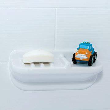 Tub car toy sitting on a soap holder