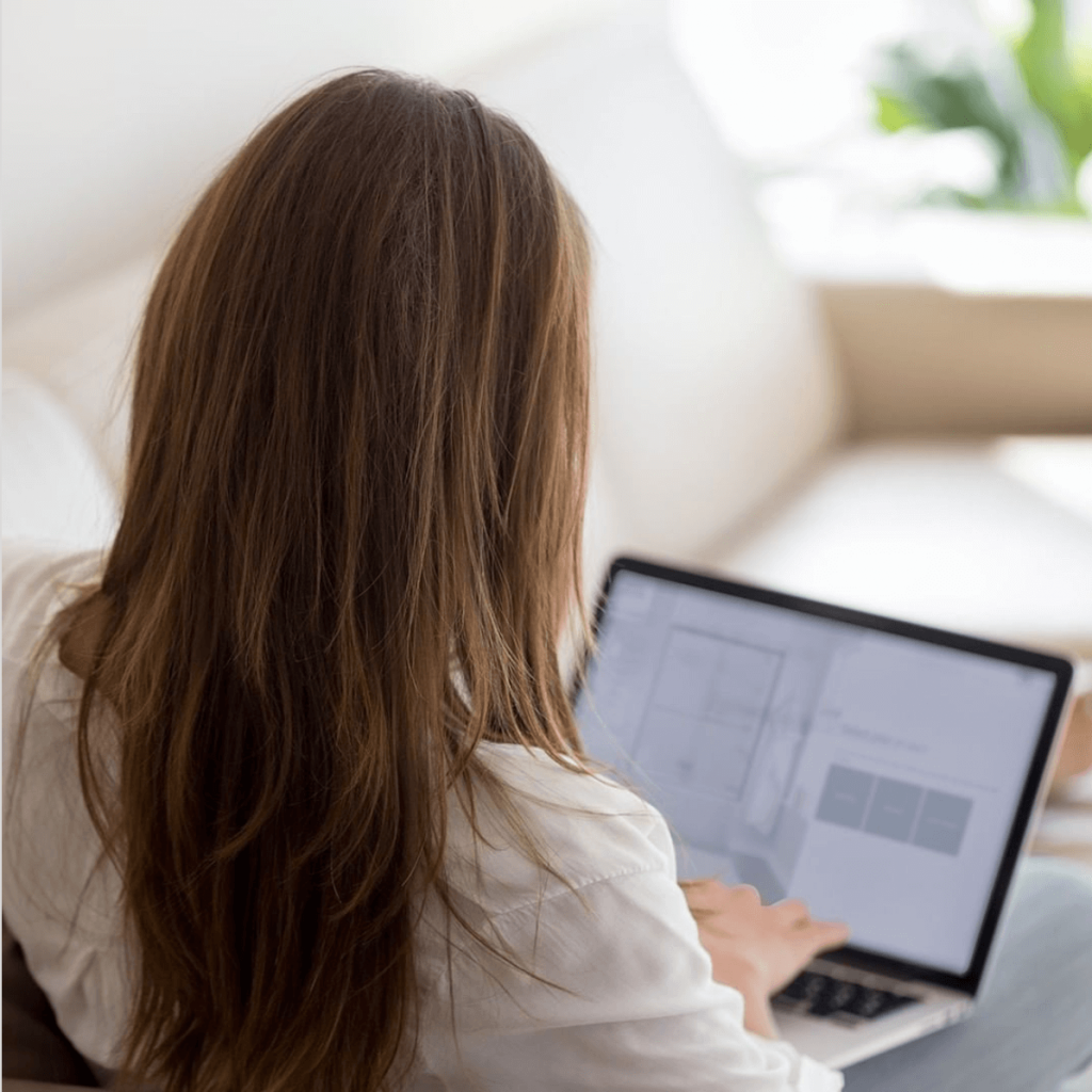 Woman doing a research on her laptop