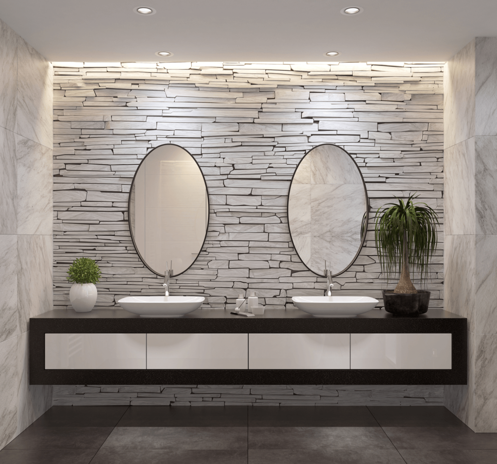 a luxurious bathroom with stone wall focal point and double vanity