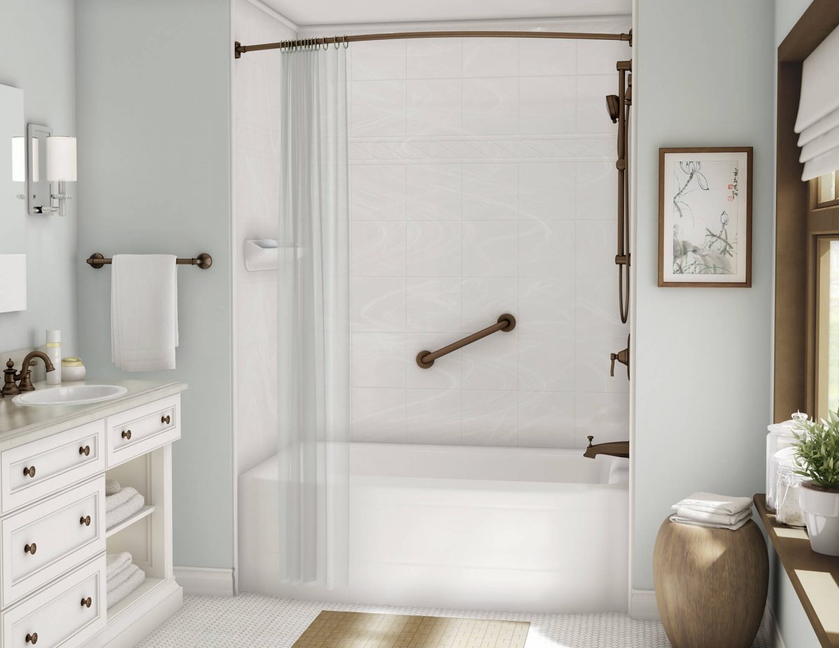 a bathroom with a white tub and oil rubbed bronze fixtures