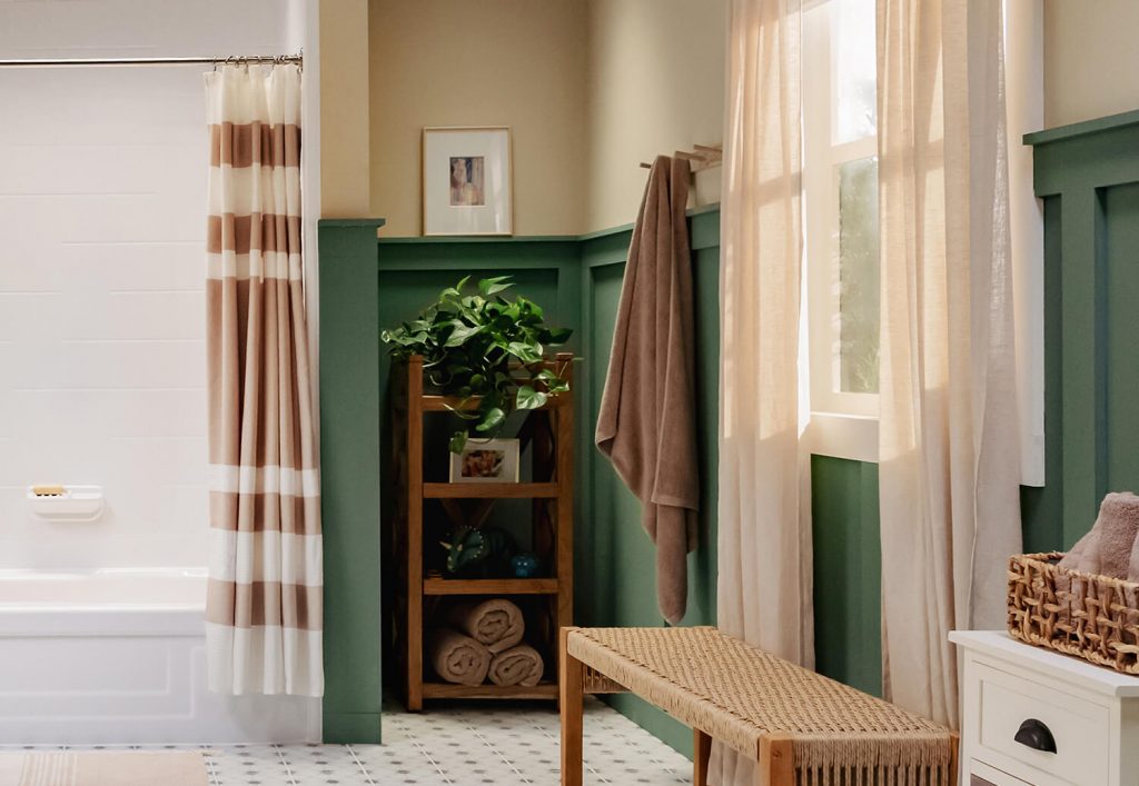 A window brings natural light to the bathroom, illuminating the tub area.