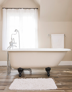 A retro clawfoot tub is on display in a bathroom