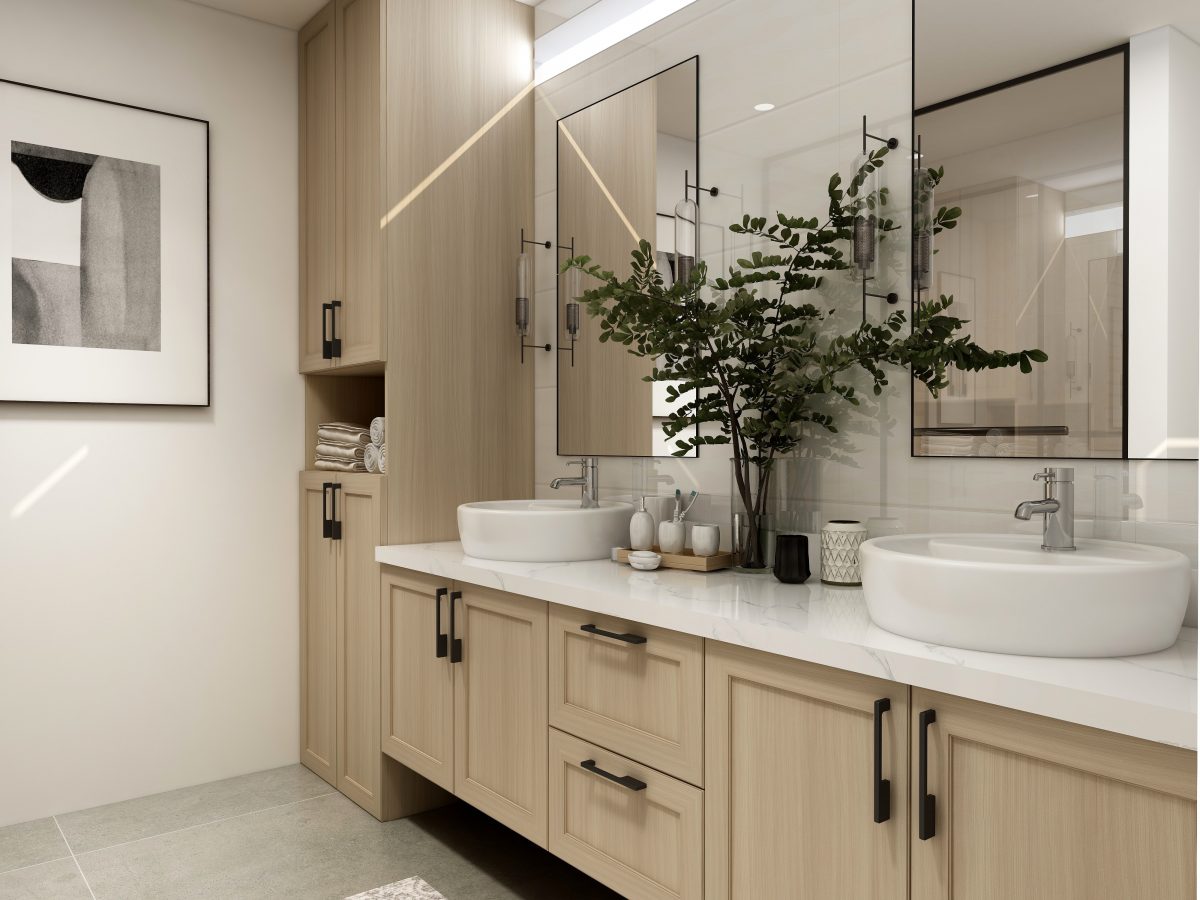 A double vanity with two sinks and mirrors with wall-to-wall cabinetry along a bathroom wall